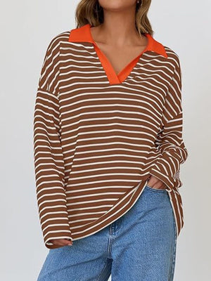 Oversized brown and white striped long-sleeve sweatshirt with orange collar detail