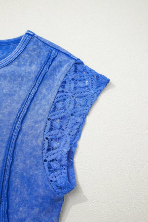 Blue mineral wash cotton tee with distressed details and lace cap sleeves.