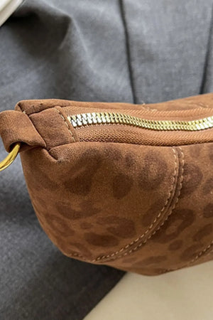 Brown leopard print crescent shoulder bag with gold zipper detail