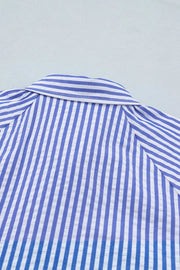 Striped button-down blouse with a textured fabric and classic collar.