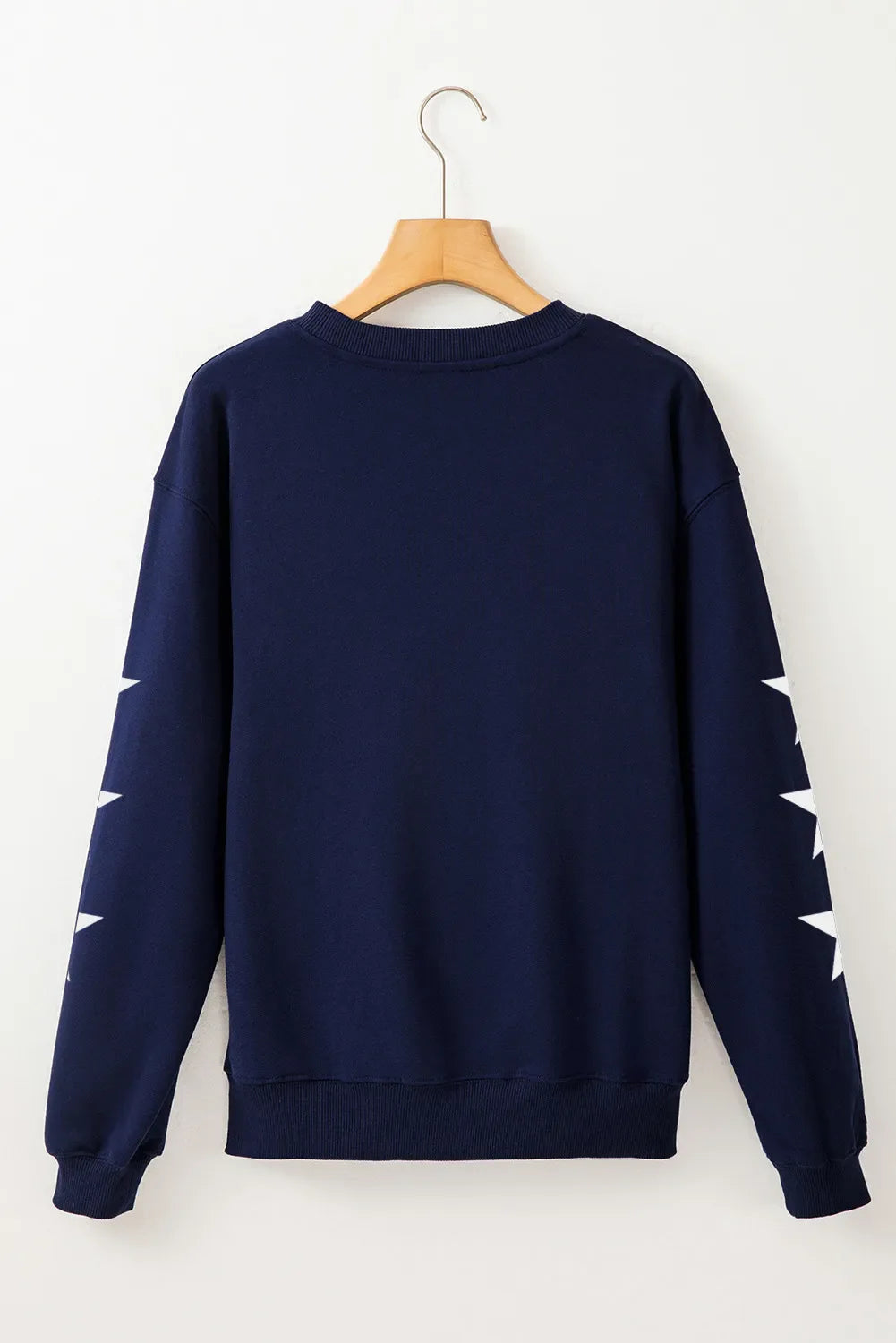 Navy sweatshirt with white stars on sleeves, crewneck, long sleeves, cotton-polyester blend.