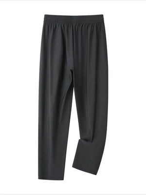 Grey men's sweatpants with elastic waistband and drawstring, relaxed fit.