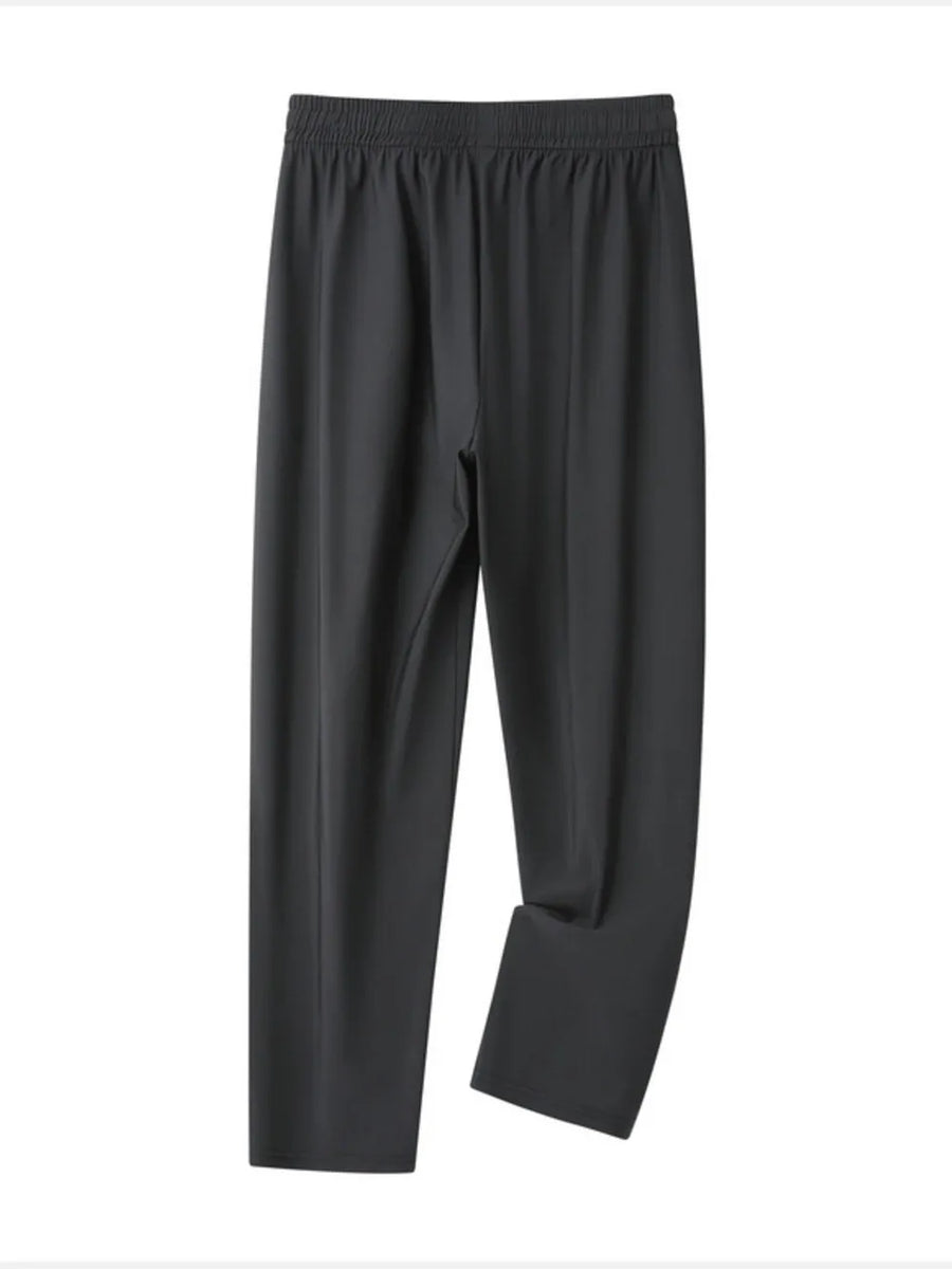 Grey men's sweatpants with elastic waistband and drawstring, relaxed fit.