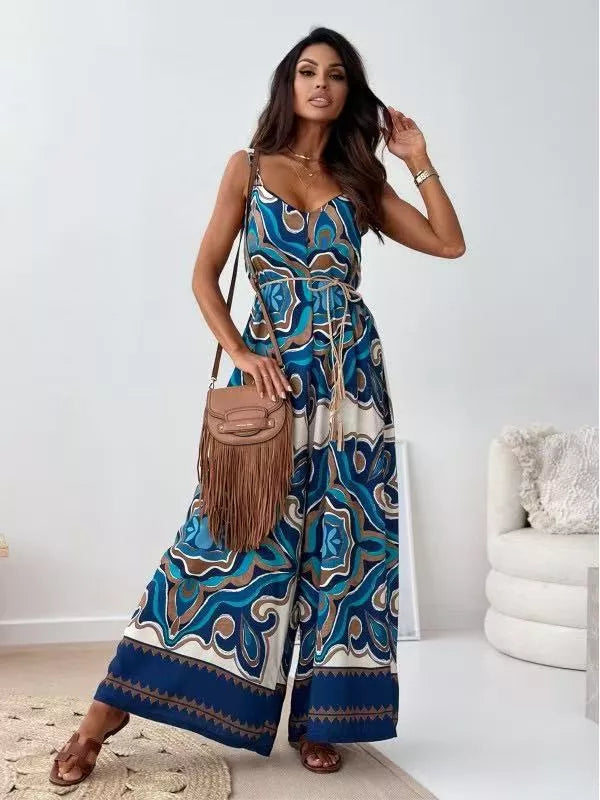 Peacock Blue paisley patterned tied wide-leg romper with V-neck and tie belt.