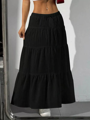Black tiered maxi skirt with elastic waistband and textured fabric