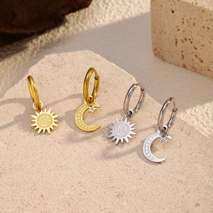 earrings in gold featuring dangle charm and dangle fit