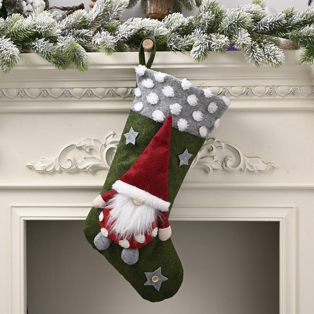 Green holiday stocking with gnome applique, gray polka dot cuff, and star details.