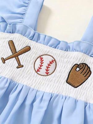 Baby blue ruffled cotton top with smocked white panel featuring baseball embroidery.