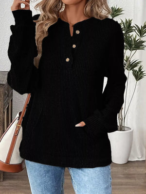 Black ribbed long-sleeve top with button detail and pocket