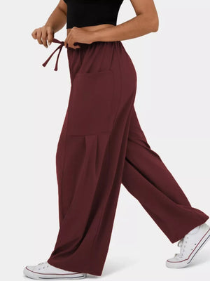 Burgundy maternity pants with adjustable drawstring and wide legs.