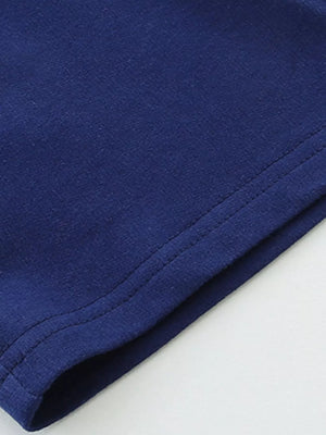 Dark blue textured fabric with visible stitching