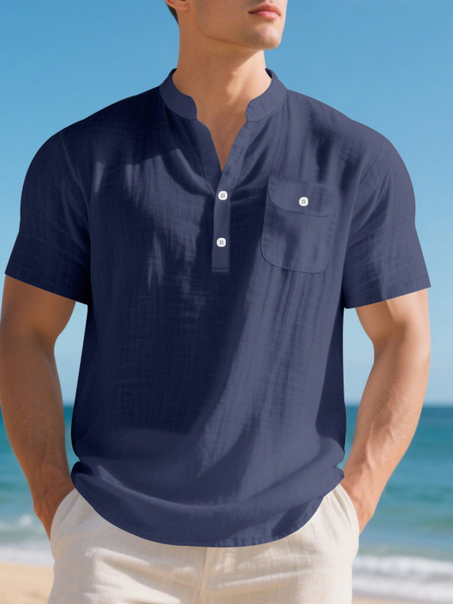 Navy blue cotton short-sleeve band-collar shirt with button-down placket and chest pocket.