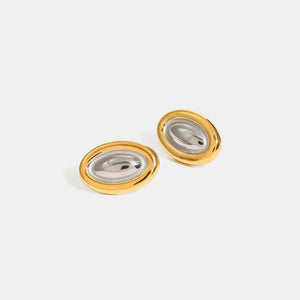 Two-tone gold oval statement earrings with a polished finish.