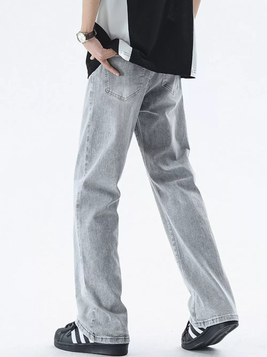 Relaxed fit light gray cotton jeans for men, shown from the back.