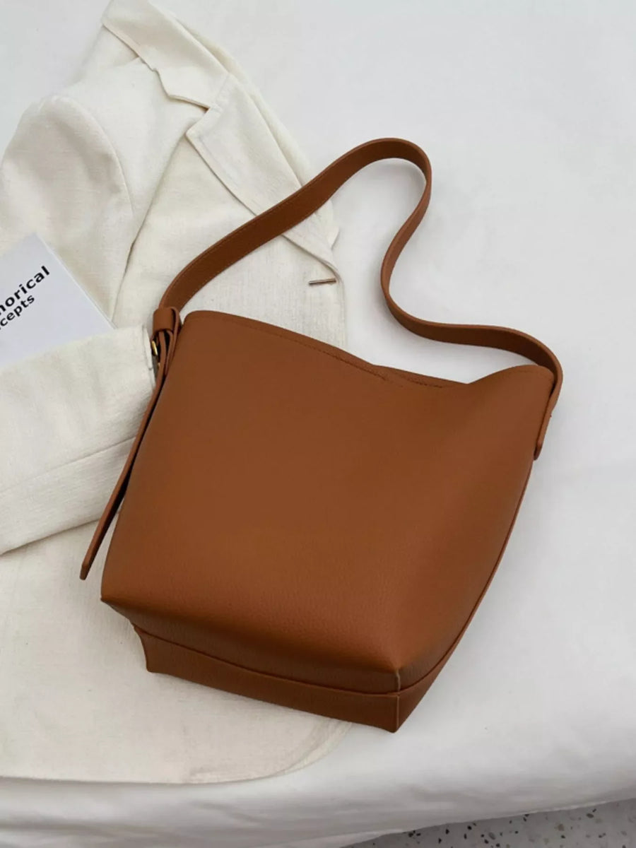 Brown minimalist PU leather shoulder bag with a single strap.