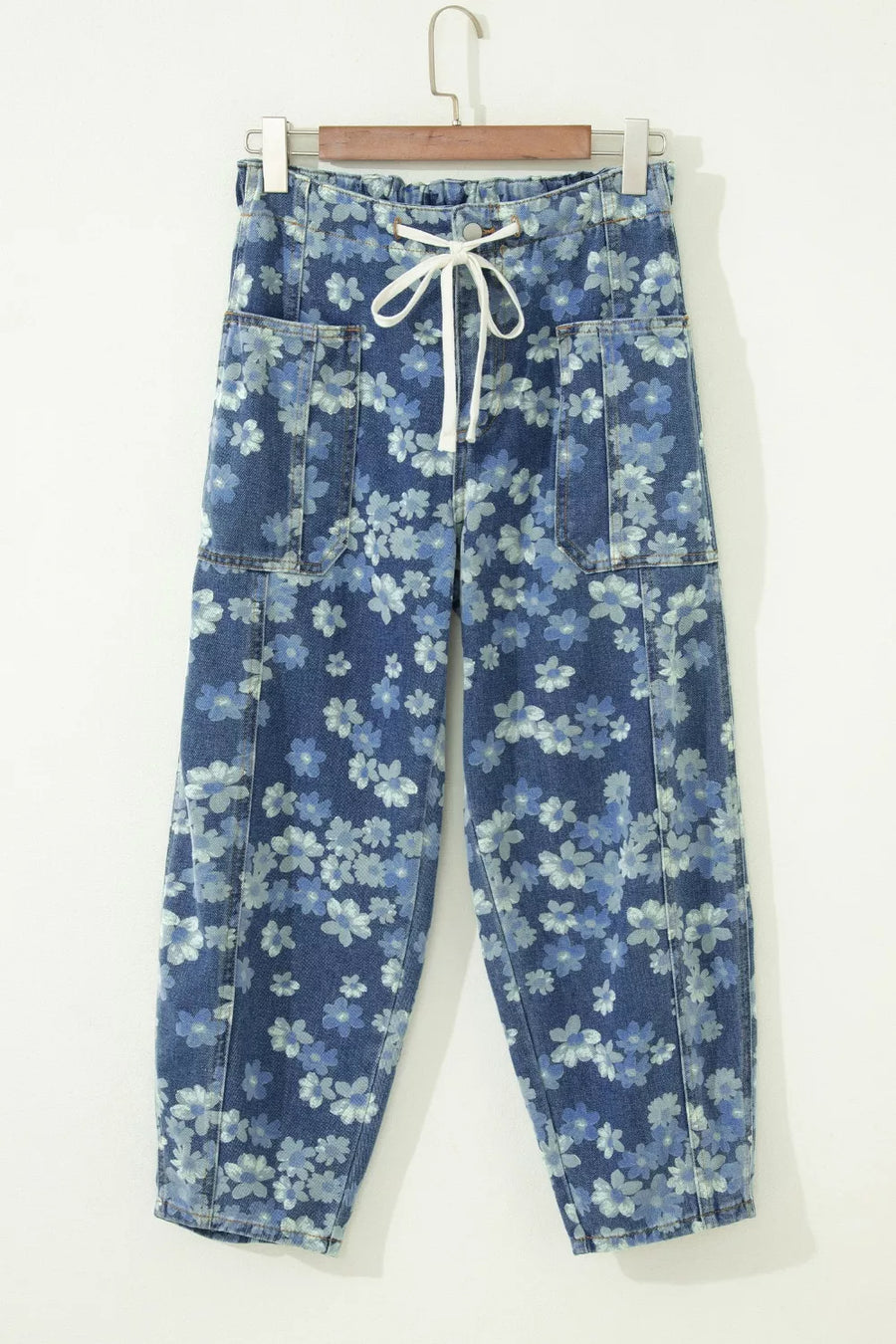 Floral drawstring barrel jeans with pockets in blue denim, featuring a cropped length and daisy pattern.