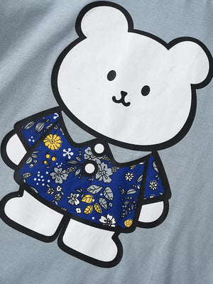 Baby t-shirt with playful bear graphic and blue floral print shirt detail.