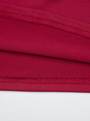 Red fitted one-shoulder t-shirt detail showing fabric texture and stitching.