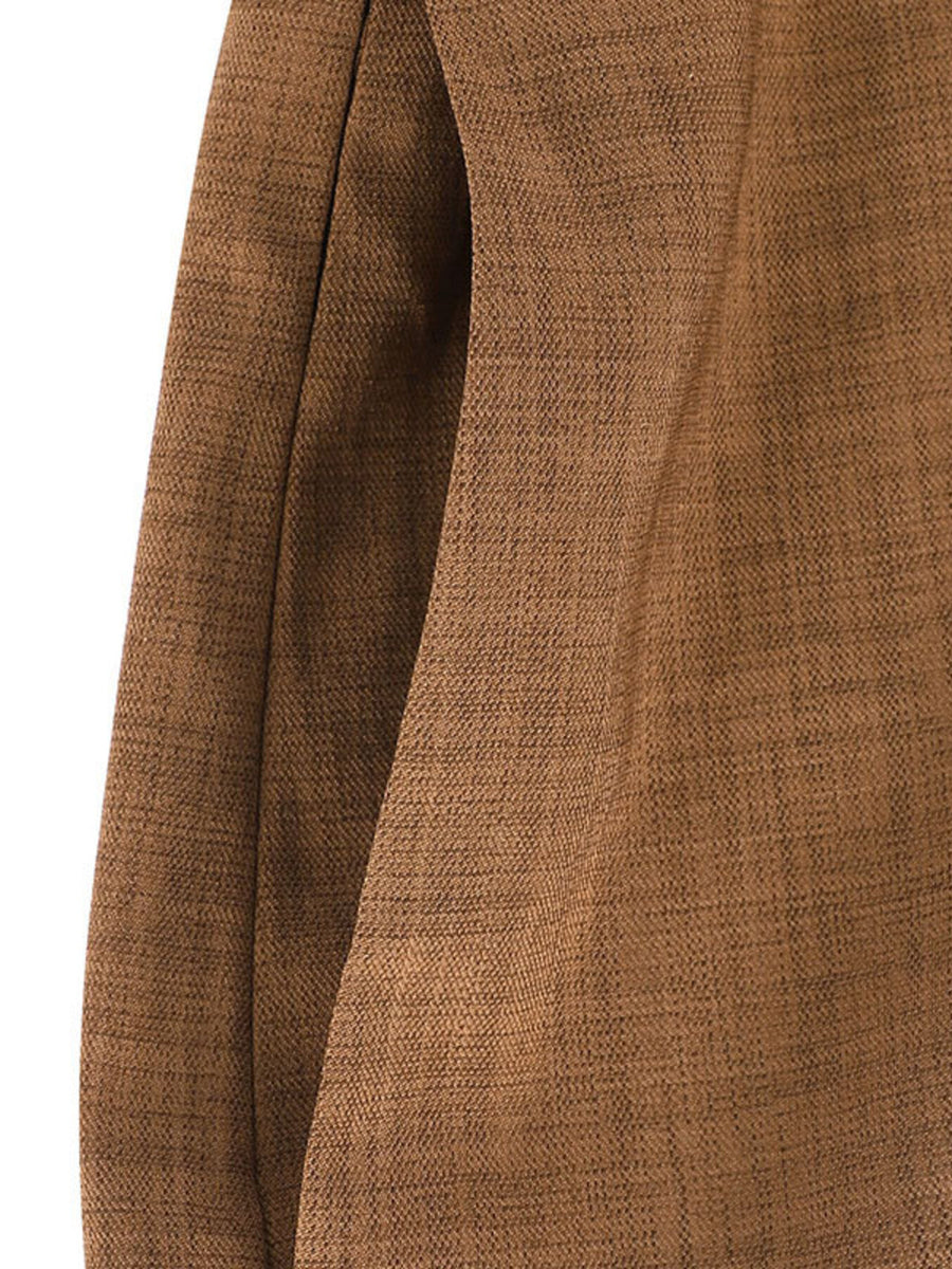 Brown wide leg jumpsuit with textured fabric and a side pocket detail.
