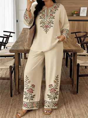 Cream embroidered peasant top and wide-leg pants set with floral motifs.