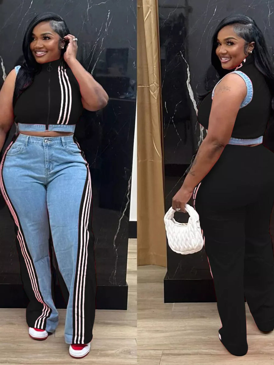Black zip-front crop top with contrast trim and wide-leg pants with side stripes.