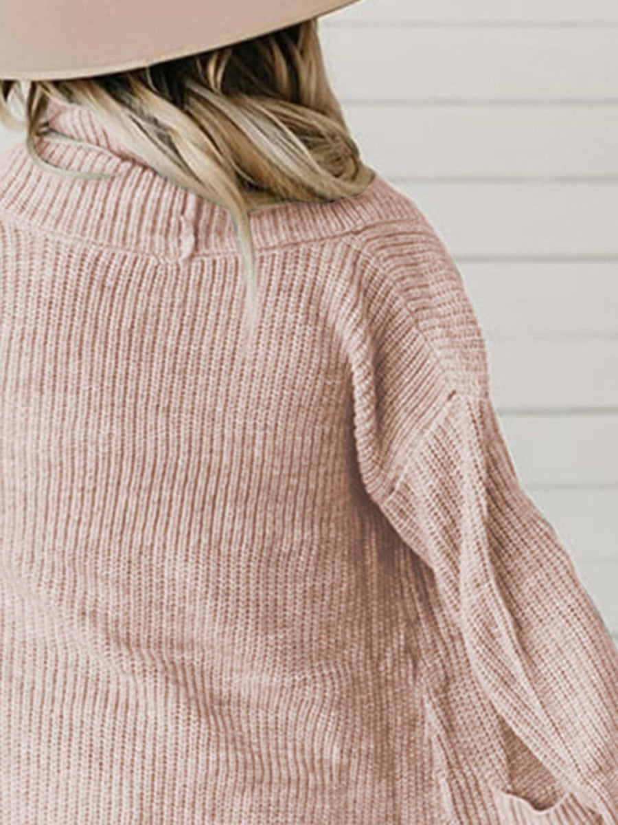 Apricot ribbed knit cardigan with a high neckline and relaxed fit.