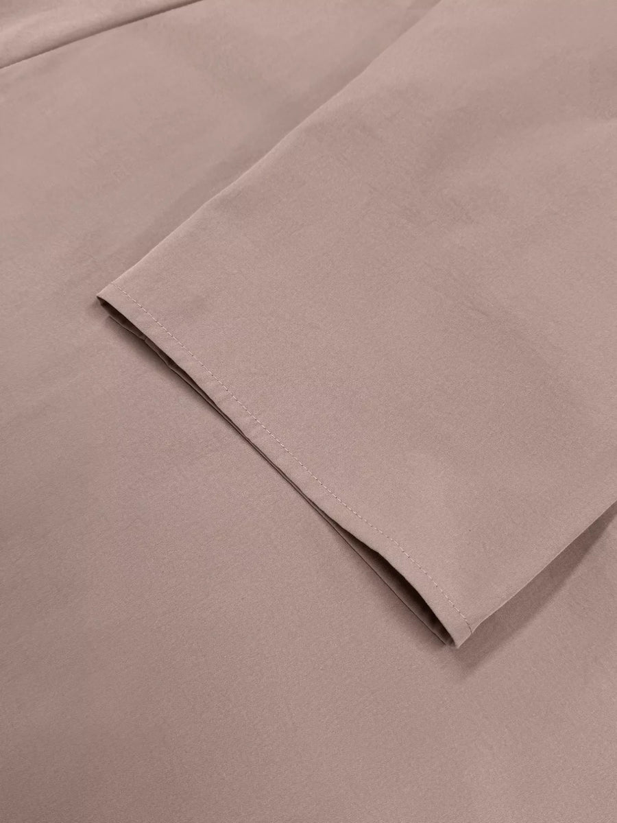 Dusty pink lightweight open front cardigan sleeve detail with clean stitching.