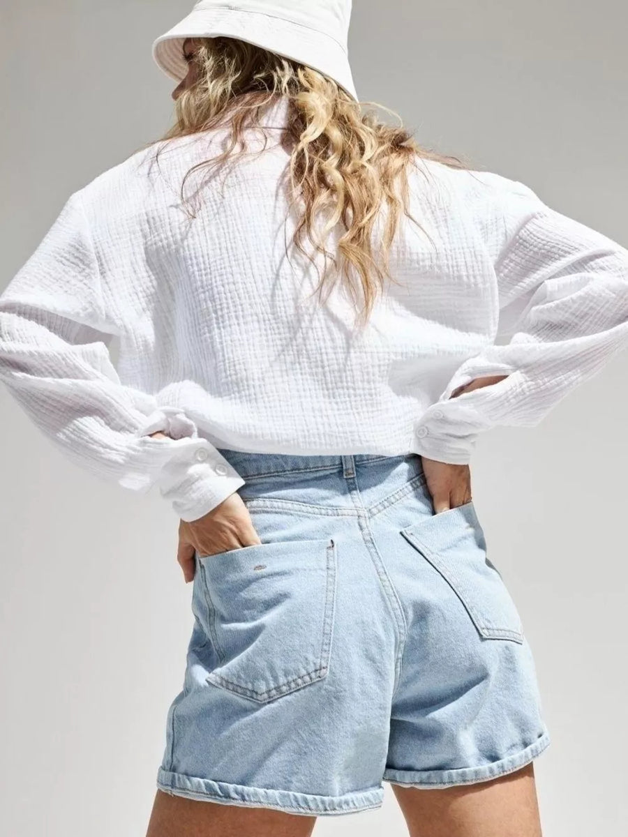 Blue button-down shirt with tunic-length and button-front