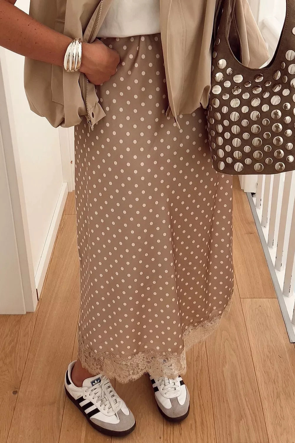 midi skirt in tan featuring lace detail and flared fit