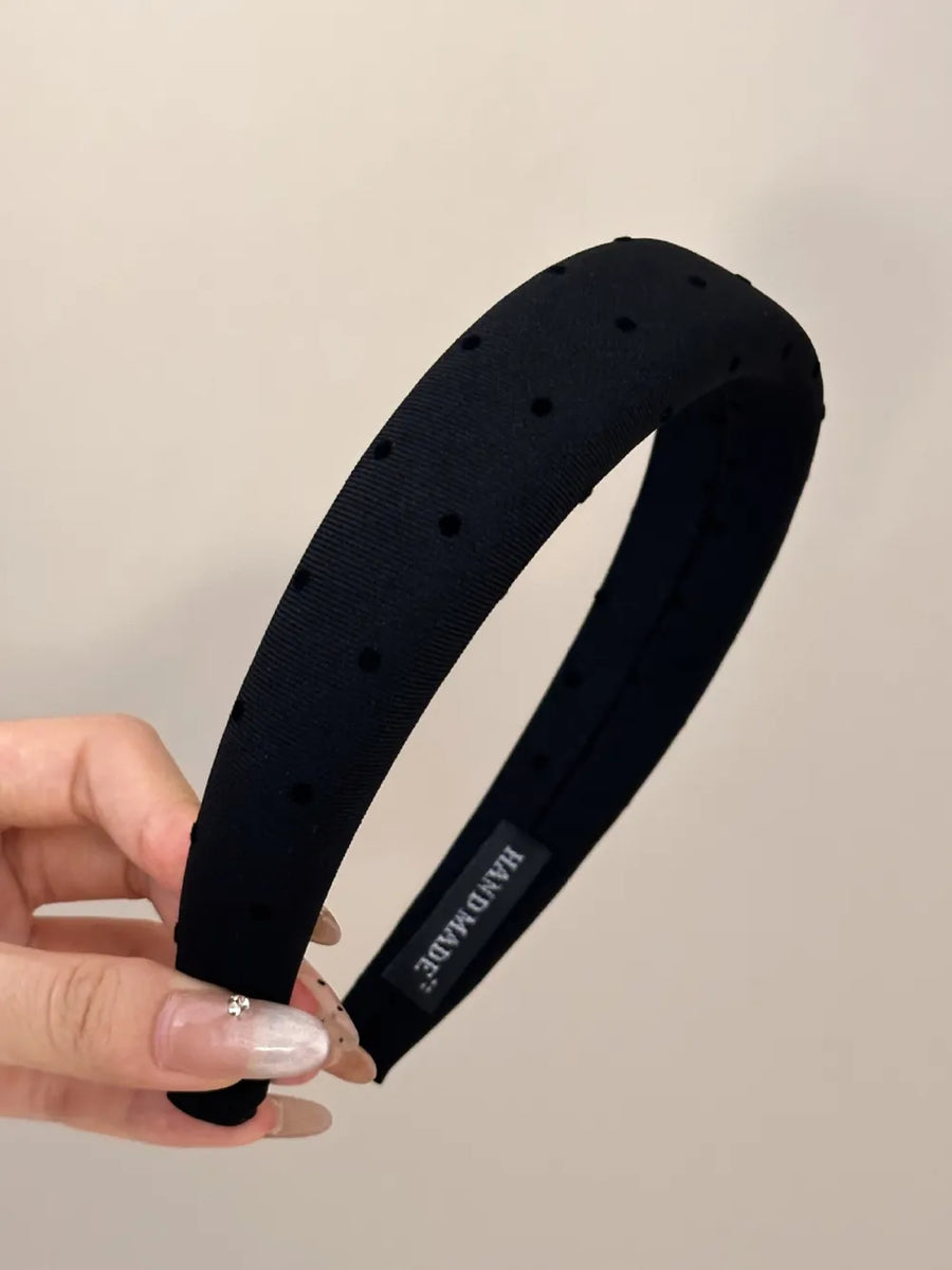 Black polka dot padded headband with handmade label