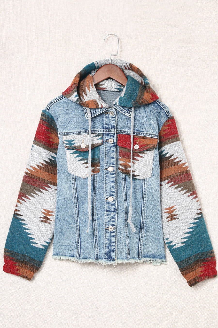 Denim hoodie jacket with Southwestern print on sleeves and hood, light blue wash cotton.