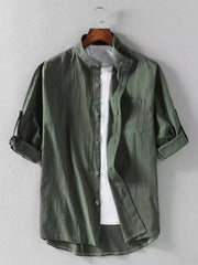 Men's army green band collar button-up shirt with rolled sleeves and chest pocket.