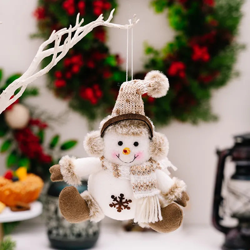 Plush snowman Christmas ornament with knit hat and scarf, brown accents.