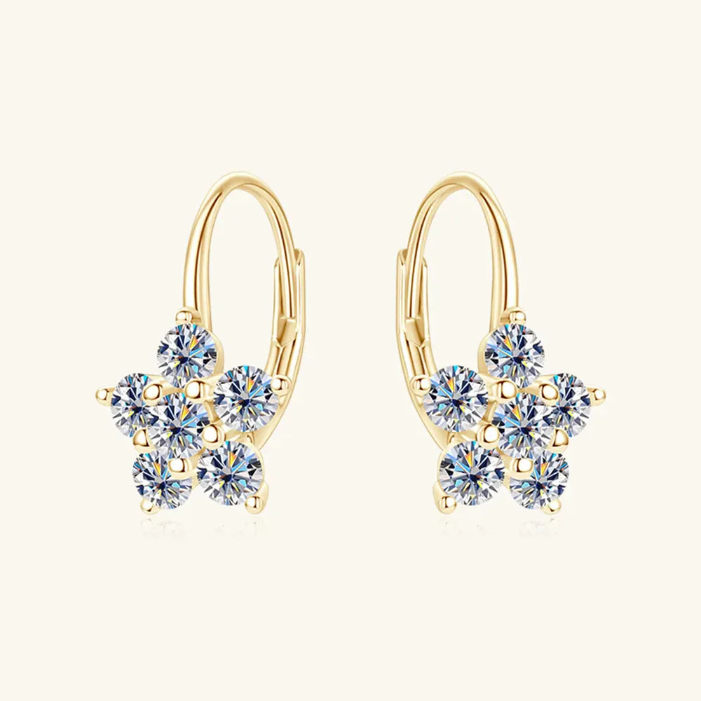 Gold celestial cluster huggie hoop earrings with clear cubic zirconia stones.
