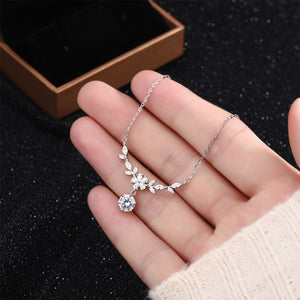 clear necklace featuring leaf motif and floral