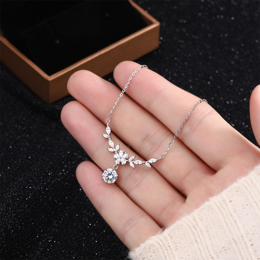 clear necklace featuring leaf motif and floral