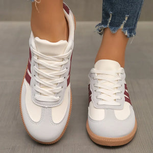 Retro stripe sneakers in eggshell with burgundy accents and white laces.