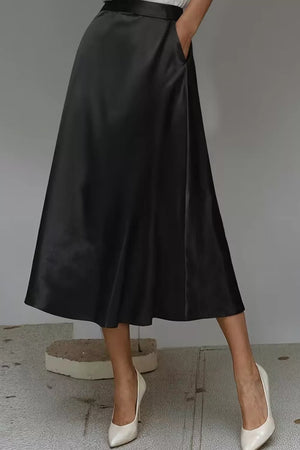 Black a-line midi skirt with hidden pockets in lustrous fabric