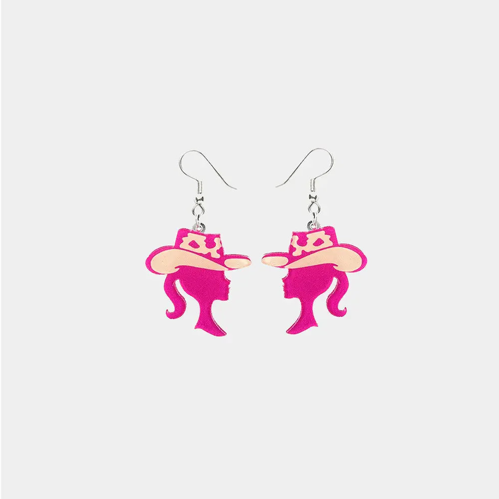 Cowgirl silhouette acrylic drop earrings in pink with tan hats.