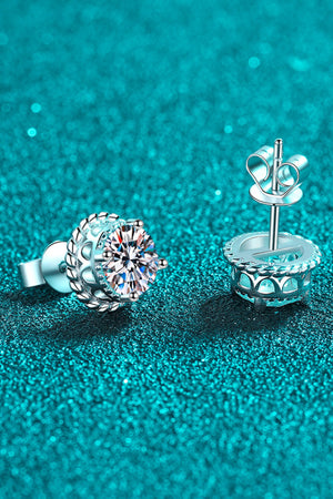 Silver rope-framed moissanite stud earrings with brilliant cut stones.