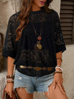 Black floral lace sheer top with lace trim and short sleeves.