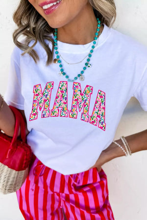 White graphic t-shirt with floral "MAMA" text, crew neck, short sleeves.