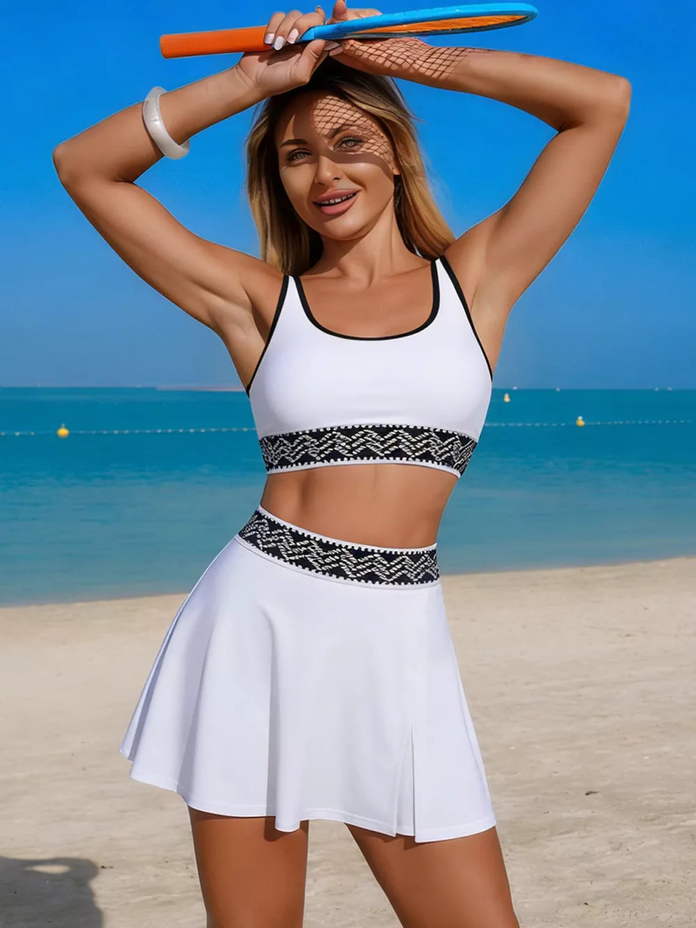 White tank and skort set with black contrast trim and geometric waistband detail