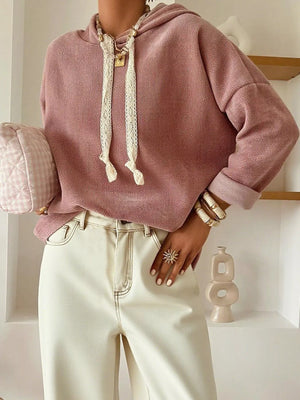 Dusty pink dropped shoulder hoodie with lace drawstring and cuffed sleeves.