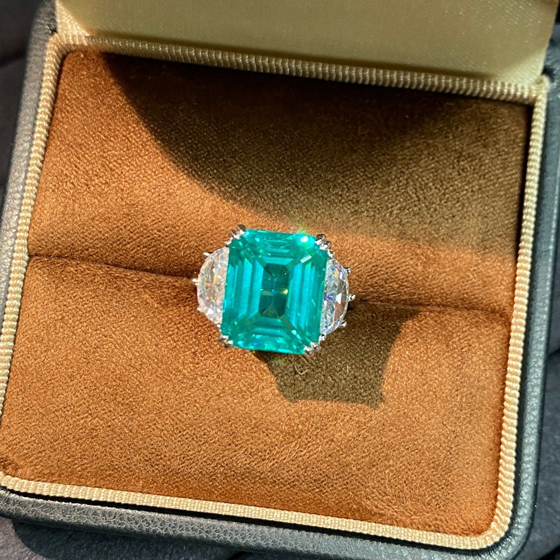 teal ring featuring zircon stones and geometric