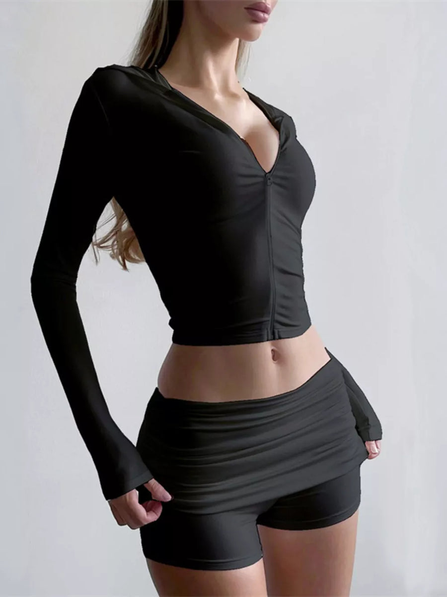 Black cropped zip-up hoodie with ruched shorts set.