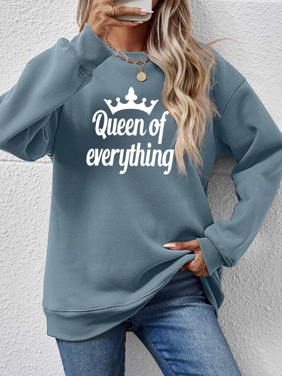 Misty Blue graphic sweatshirt with "Queen of Everything" text and crown detail.