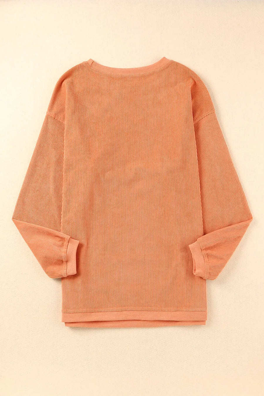 Sherbet corduroy crewneck sweatshirt with vertical ribbing and crew neckline.