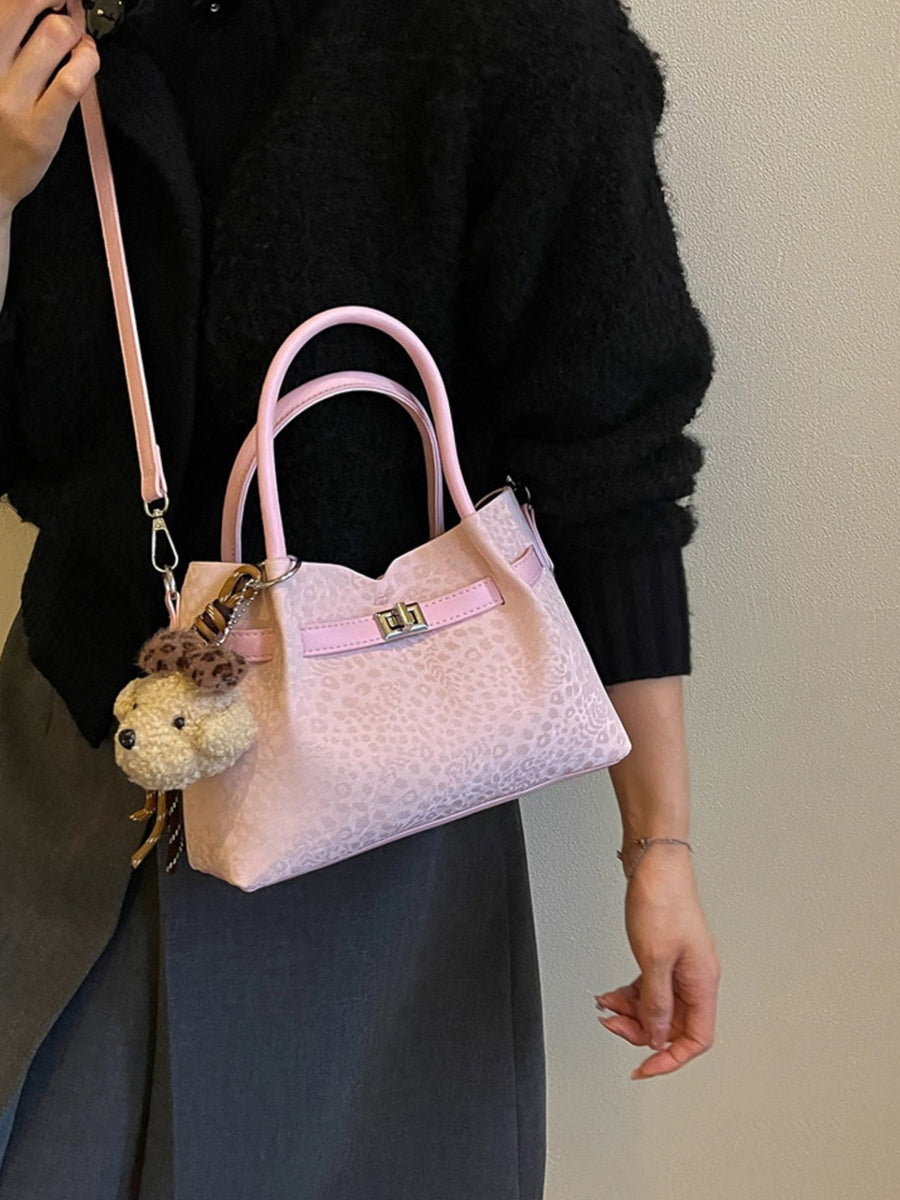 crossbody bag in light pink with leopard and buckle detail