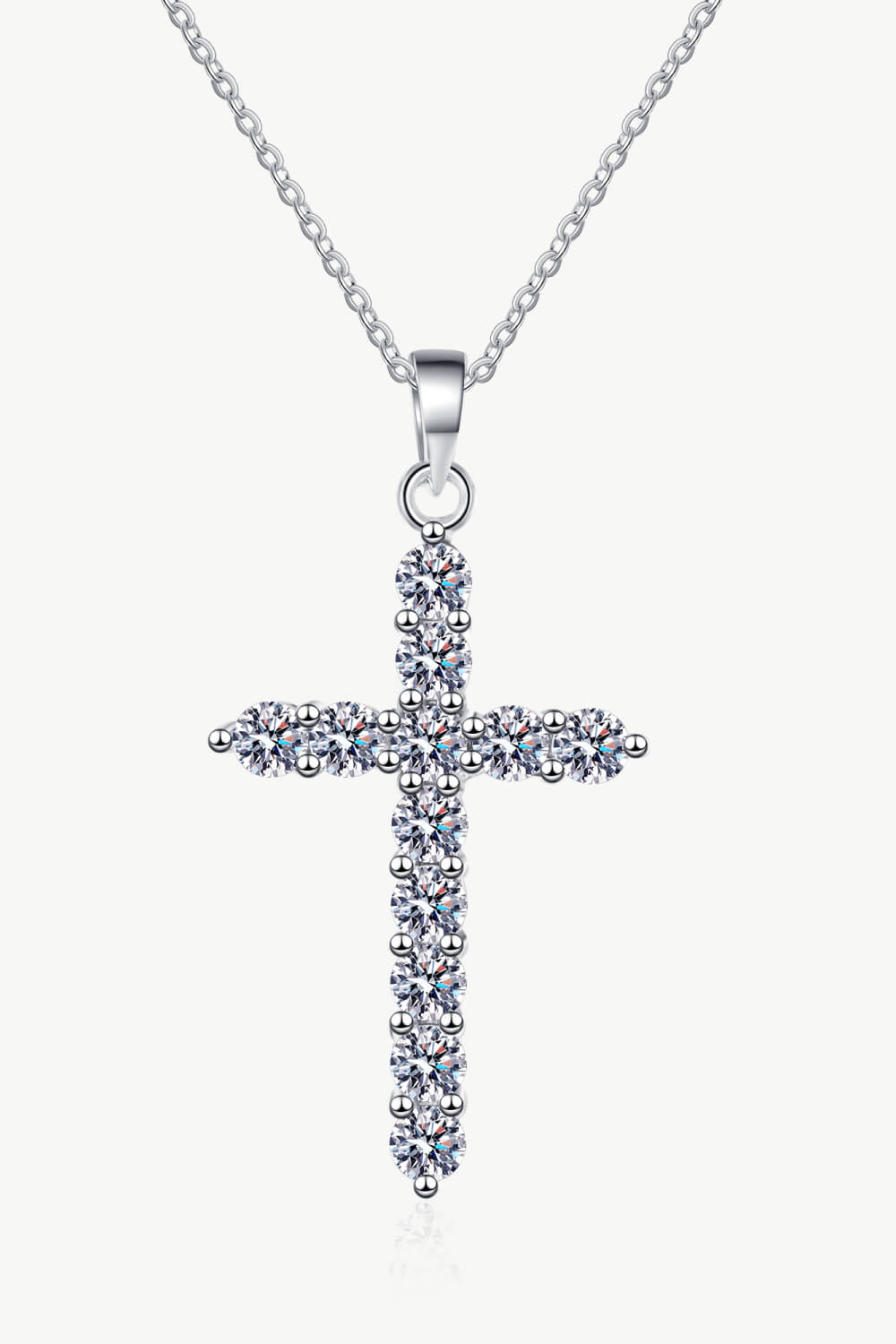 Silver pavé diamond cross pendant necklace with a delicate chain.